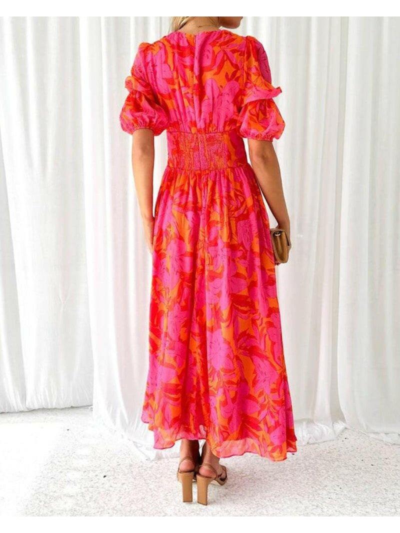 Elegant red and pink V-neck puff sleeve maxi dress by Lumina Vancouver, featuring flowing fabric and stylish design.