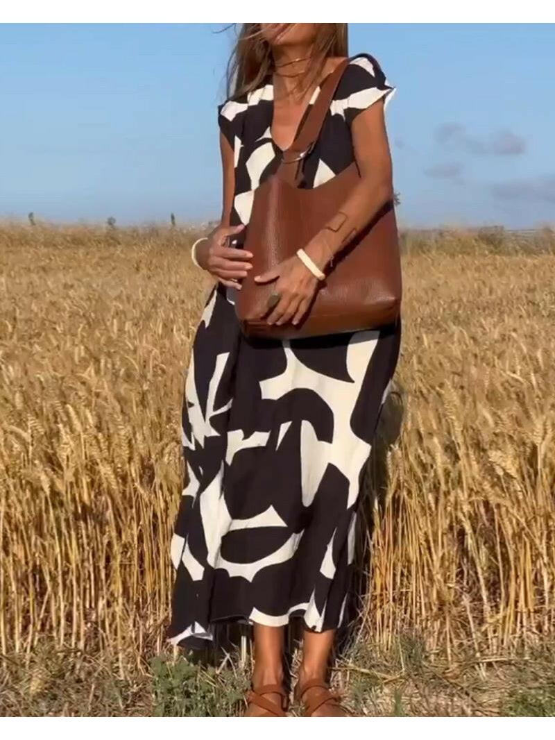Black Alvina™ Relaxed Abstract Dress by Lumina Vancouver, featuring a flowy silhouette and artistic print.