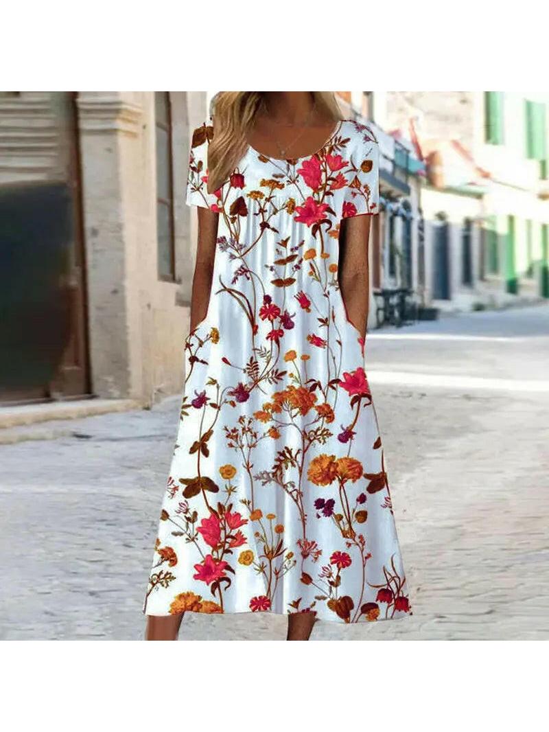 Alya elegant boho floral maxi dress by Lumina Vancouver, featuring tummy coverage and flowing red fabric.
