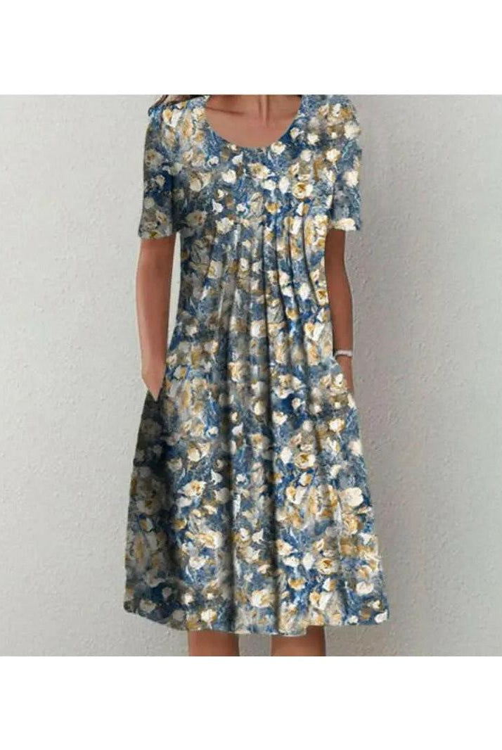 Red floral printed dress by Lumina Wear, Violette classic dress with elegant design, shown laid flat.
