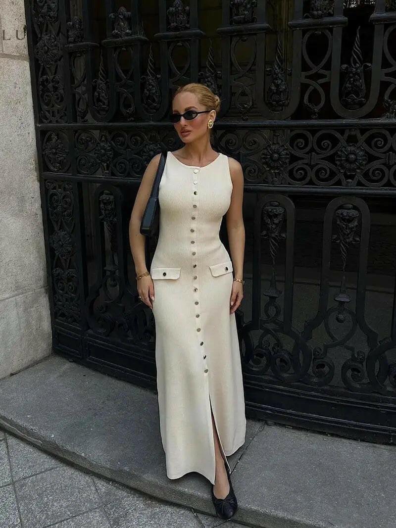 Beige Amaris maxi dress by Lumina Vancouver, suitable for autumn, shown on a mannequin with flowy fabric and long sleeves.