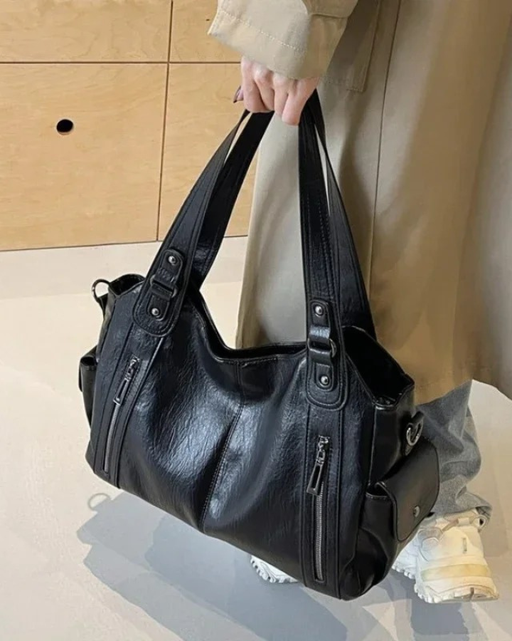 Elegant black shoulder handbag by Lumina Wear featuring functional design and spacious interior for versatile style.