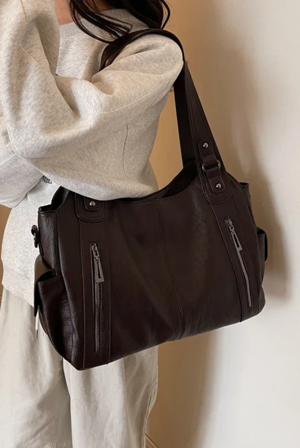 Elegant black shoulder bag by Lumina Wear featuring functional design, suitable for stylish everyday use.