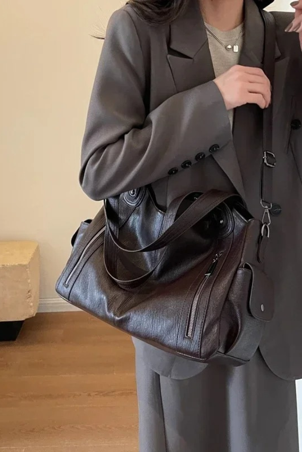 Elegant black shoulder bag by Lumina Wear featuring a functional design, perfect for stylish everyday use.