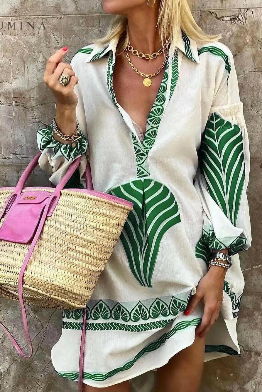 Amber Printed Mini Dress from Lumina Vancouver's Summer Dress Collection, featuring a green floral pattern and lightweight fabric.