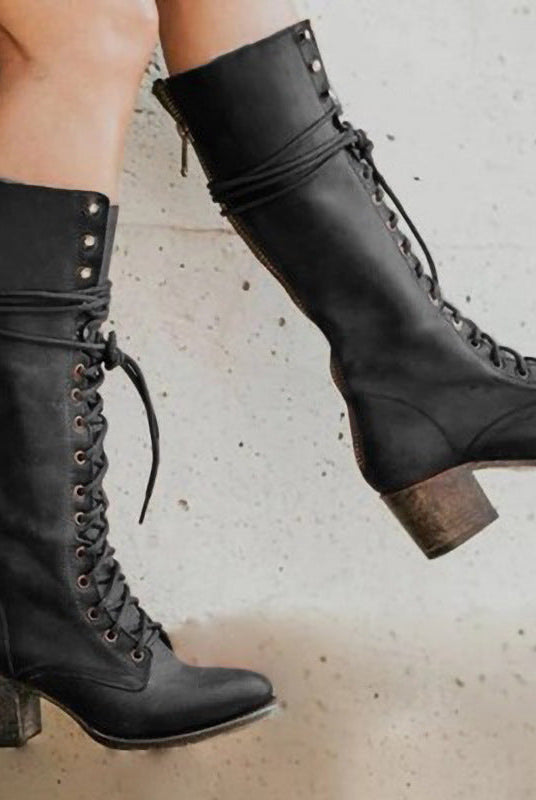 Black Amelia knee-high boots by Lumina Wear, featuring edgy lace-up design and chunky block heel, perfect for stylish women.