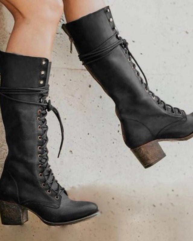 Black lace-up knee-high boots with block heel from Lumina Wear featuring edgy style and sleek design.