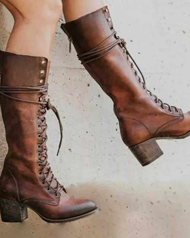 Black lace-up knee-high boots with block heel from Lumina Wear, featuring edgy style and sleek design for women.