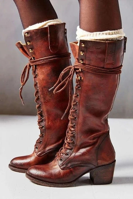 Black lace-up knee-high boots with block heel from Lumina Wear, featuring edgy style and sleek design for women.