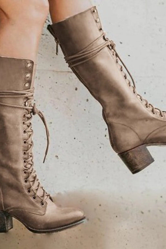 Black leather knee-high boots with lace-up front and block heel from Lumina Wear, styled with pointed toes and sleek design.