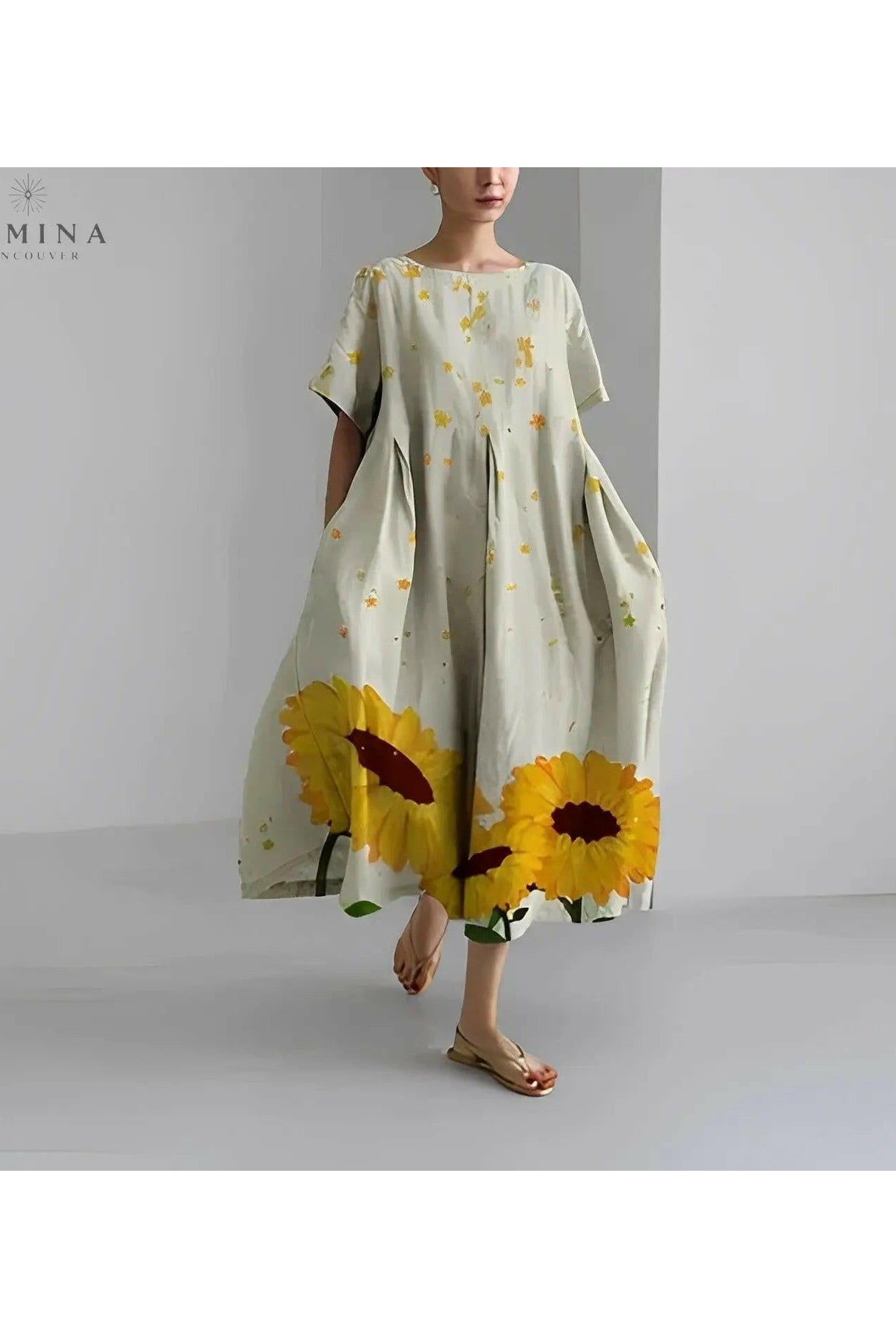 Lumina Wear Amelia floral dress with vibrant flower pattern, featuring a flowing silhouette and lightweight fabric.