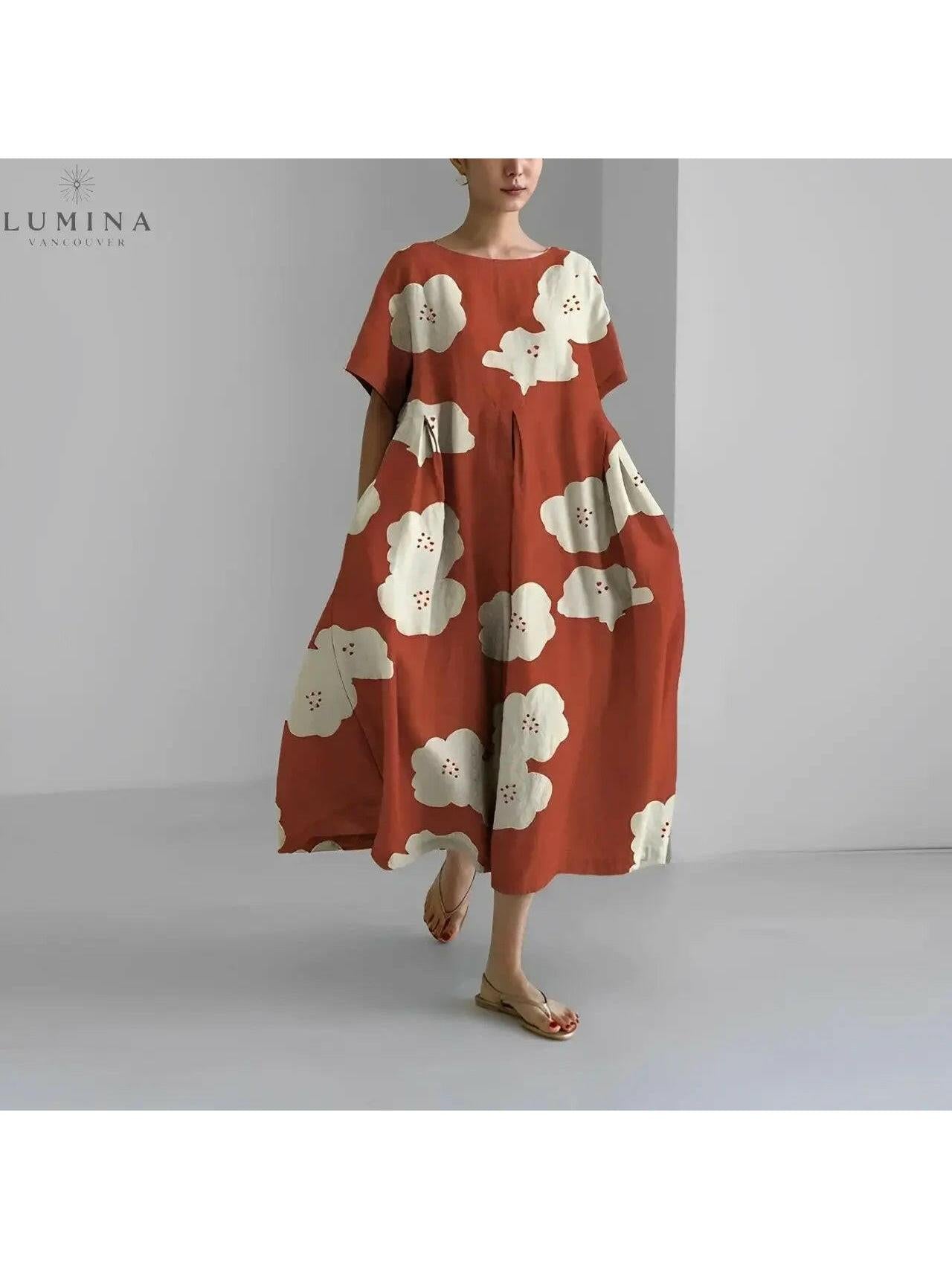 Lumina Vancouver Amelia floral dress featuring a vibrant flower pattern, lightweight fabric, and elegant sleeveless design.