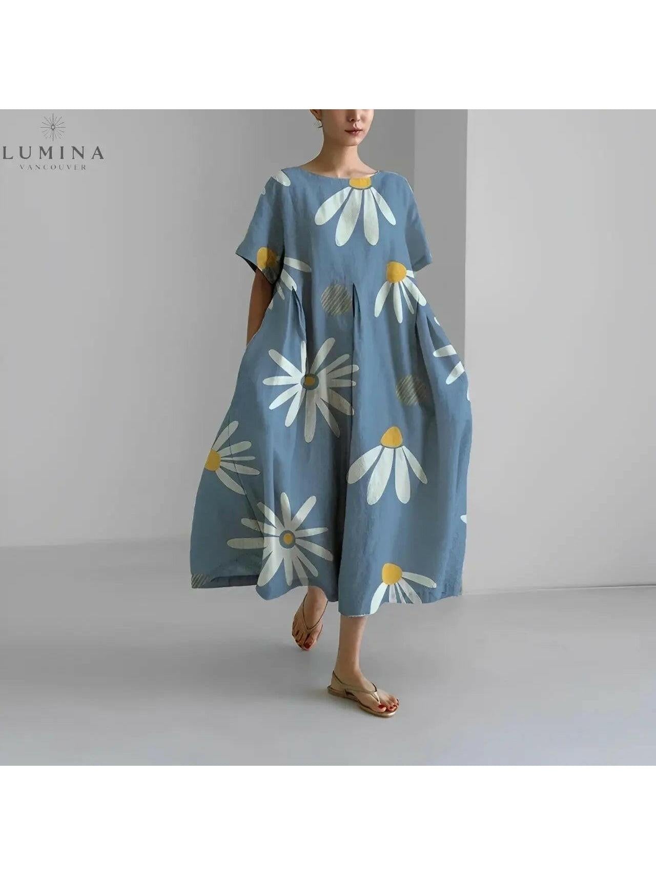 Lumina Vancouver Amelia floral dress with colorful flower print, sleeveless design, and lightweight fabric perfect for warm weather.