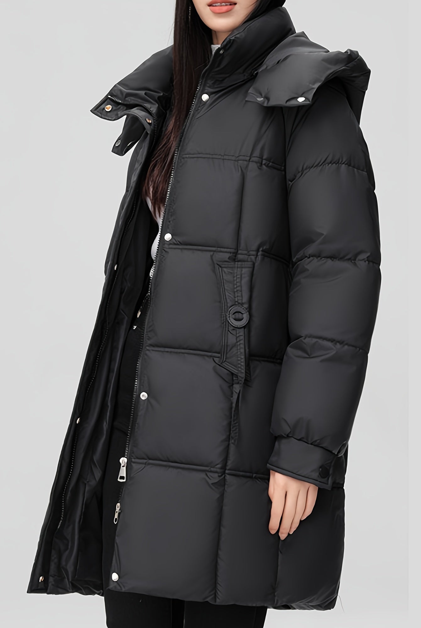 Black Amelia Lumina Wear hooded longline puffer coat with belt, stylish and insulated winter outerwear for women.