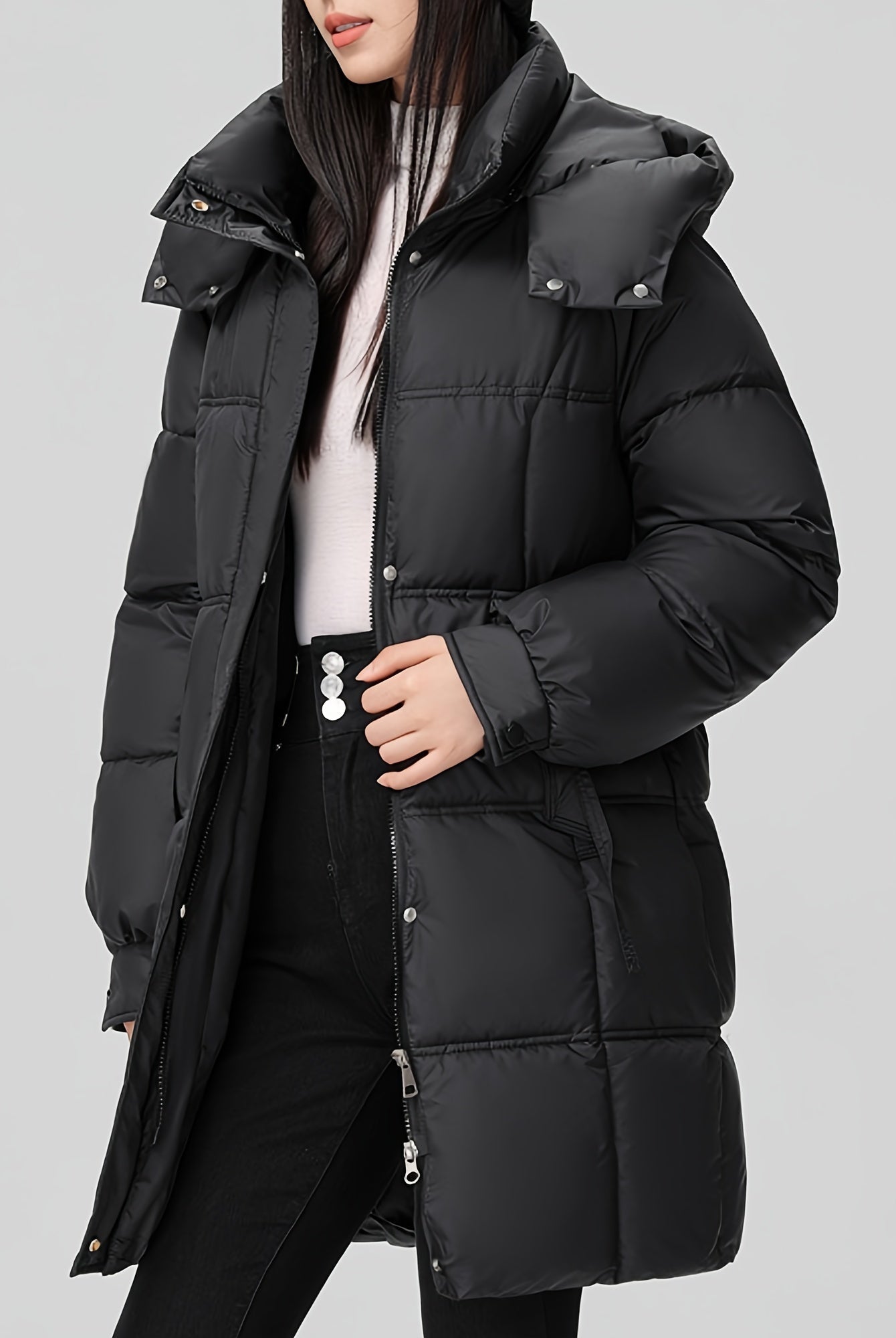 Black Amelia Lumina Wear hooded longline puffer coat with belt, stylish winter outerwear with a cozy, padded design and belt detail.