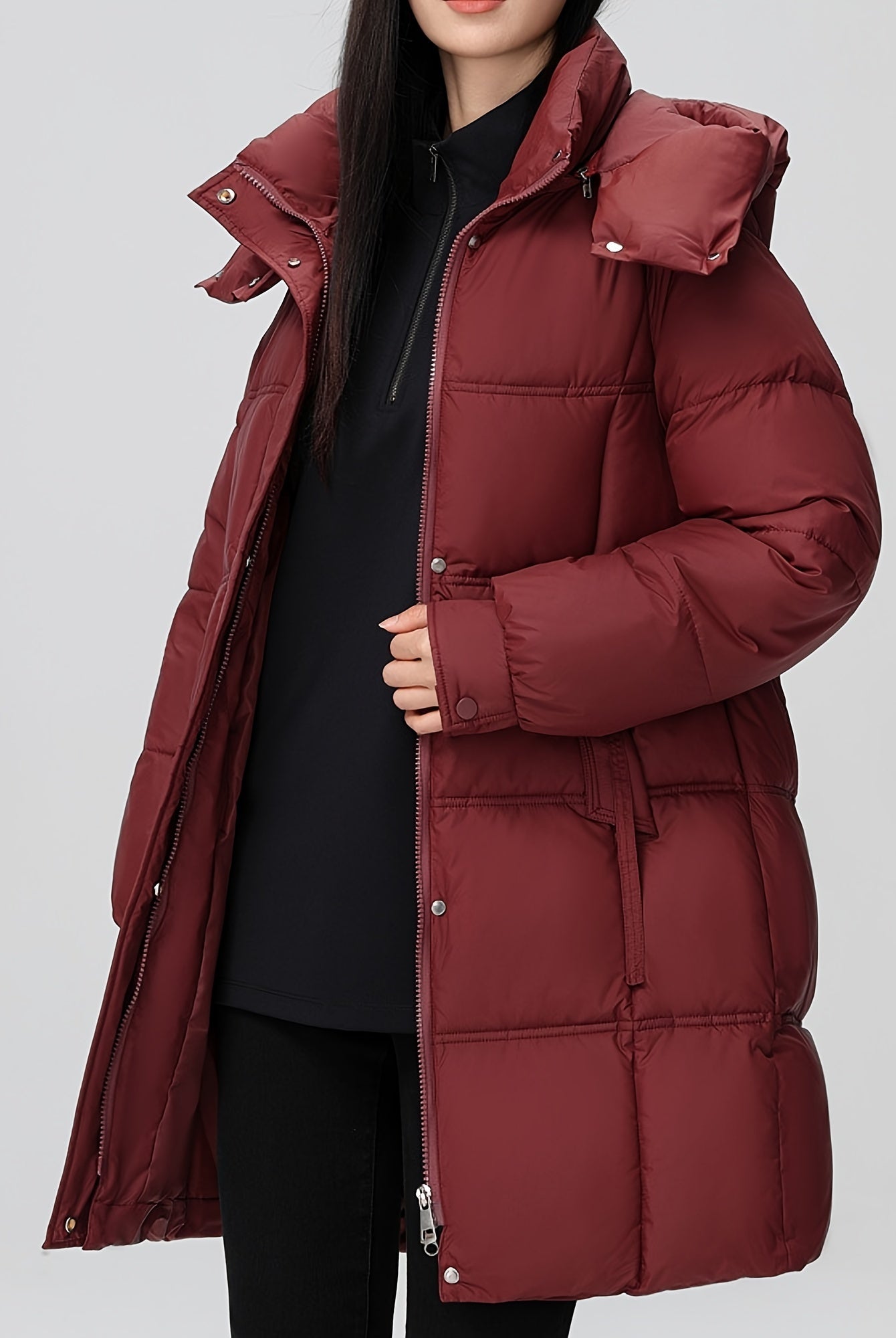 Black Amelia Lumina Wear hooded longline puffer coat with belt, stylish and warm winter outerwear, XS size.