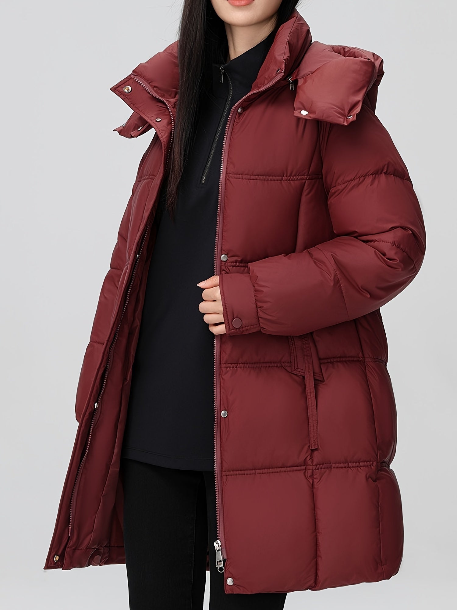 Black Amelia Lumina Wear hooded longline puffer coat with belt, stylish and warm winter outerwear, XS size.