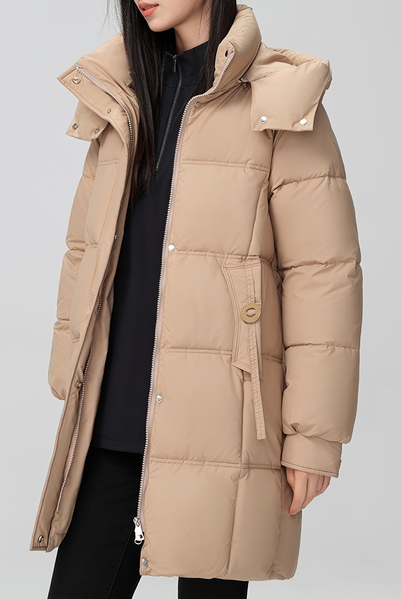 Black Amelia Lumina Wear hooded longline puffer coat with belt, stylish winter outerwear with a cozy, padded design.