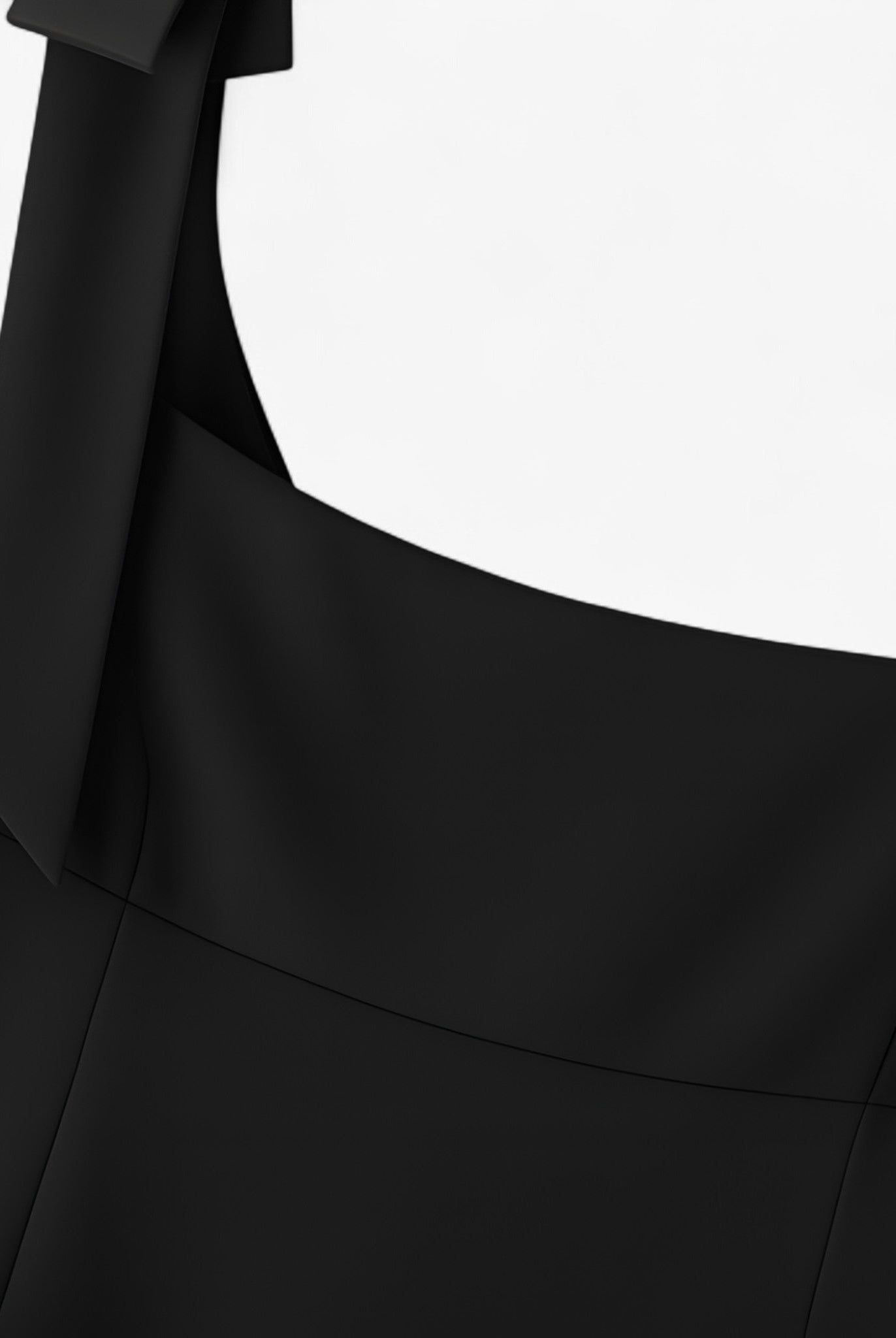 Black Lumina Wear Amelie camisole with bow detail and zipper closure, showcasing elegant design and fitted style.
