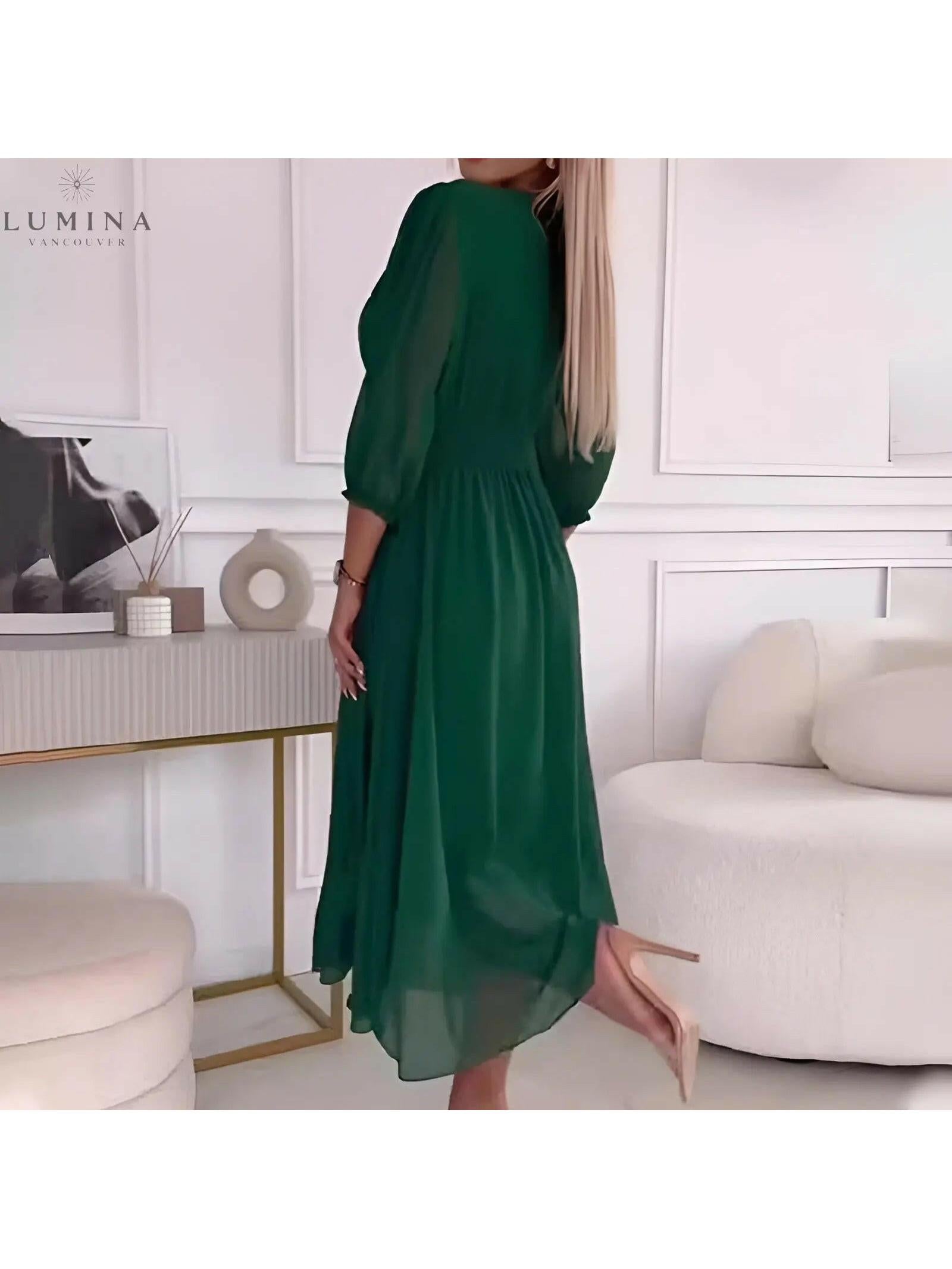 Blue Ana stylish wrap dress from Lumina Vancouver, perfect for wedding guests, featuring a flattering silhouette and elegant design.