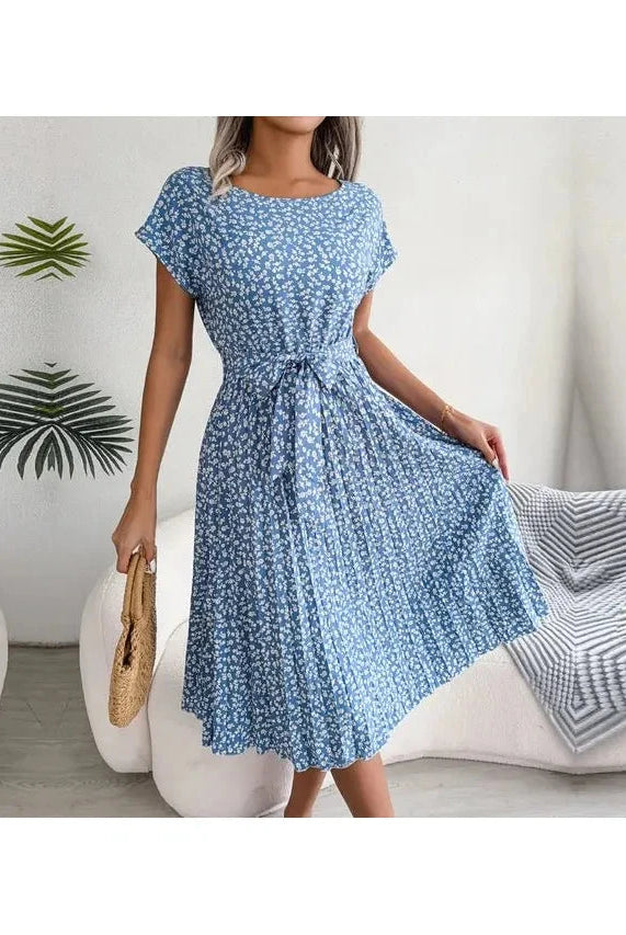 Blue Anabelle™ floral pleated midi dress by Lumina Vancouver, featuring elegant pleats and a flowy silhouette.