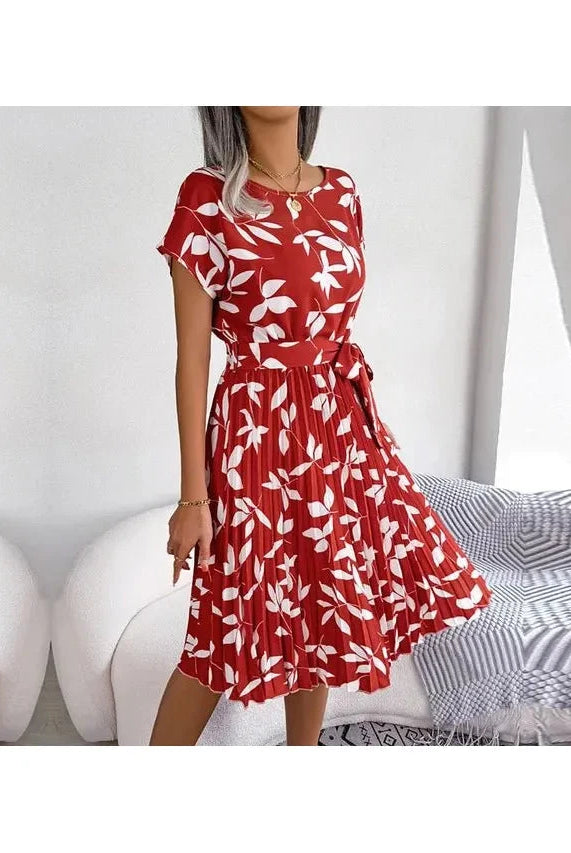 Blue Anabelle™ floral pleated midi dress by Lumina Vancouver, showing elegant pleats and a flowing silhouette.