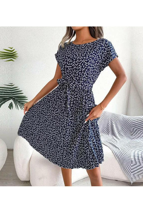 Blue Anabelle™ floral pleated midi dress by Lumina Vancouver, featuring a flowing design and elegant midi length.