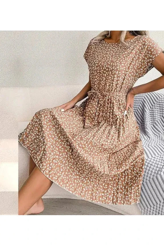 Blue Anabelle™ floral pleated midi dress by Lumina Vancouver, featuring a flowing silhouette and intricate floral pattern.