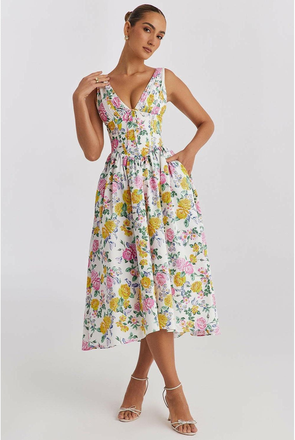 Yellow floral summer dress by Lumina Wear with a flowing silhouette and elegant design, perfect for warm-weather occasions.