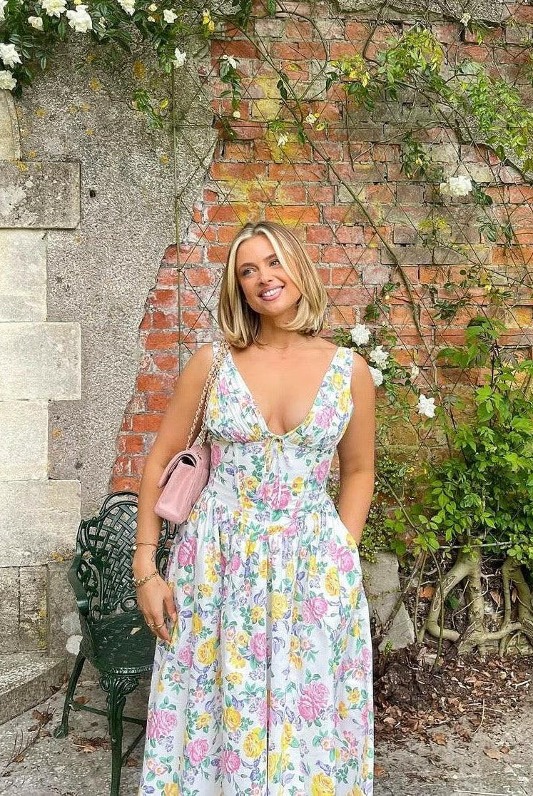 Yellow floral summer dress by Lumina Wear, Angelica style, showing lightweight fabric and elegant design for warm weather.