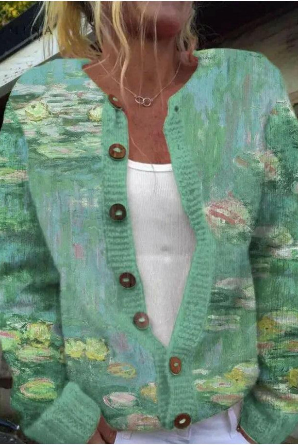 Light gray Anwen cardigan by Lumina Wear, featuring a soft knit texture and relaxed fit, displayed on a hanger.