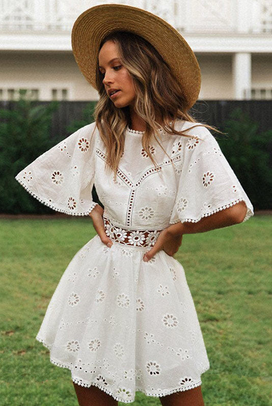 Arabella Celestine white eyelet mini dress by Lumina Vancouver, featuring delicate eyelet details and a fitted silhouette.