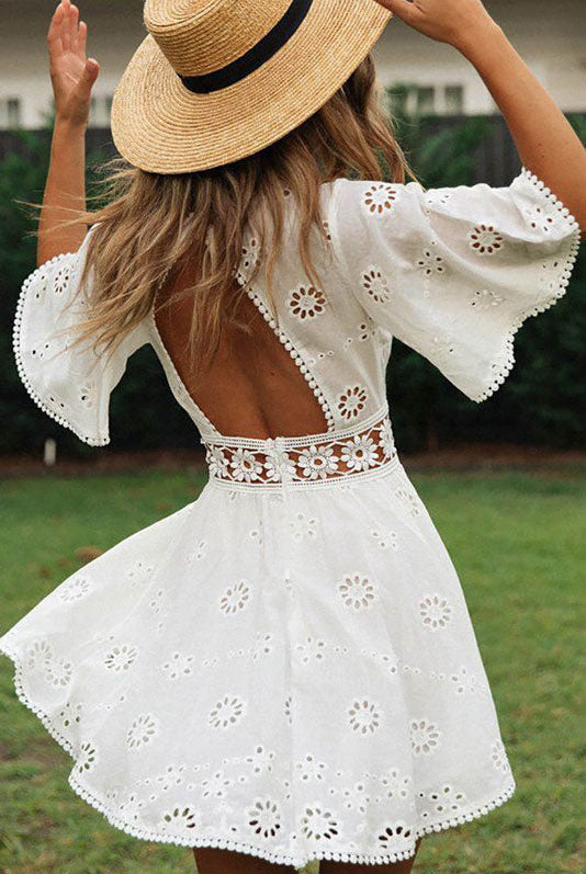 Arabella Celestine white eyelet mini dress by Lumina Vancouver, featuring a fitted silhouette and delicate eyelet fabric.