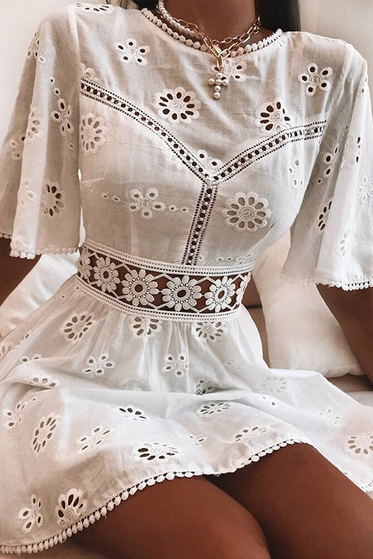 Arabella Celestine white eyelet mini dress by Lumina Vancouver, featuring a fitted silhouette and delicate eyelet fabric.