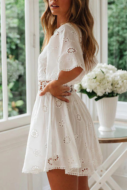 Arabella Celestine eyelet mini dress by Lumina Vancouver, featuring a white, lightweight fabric with delicate eyelet detailing.