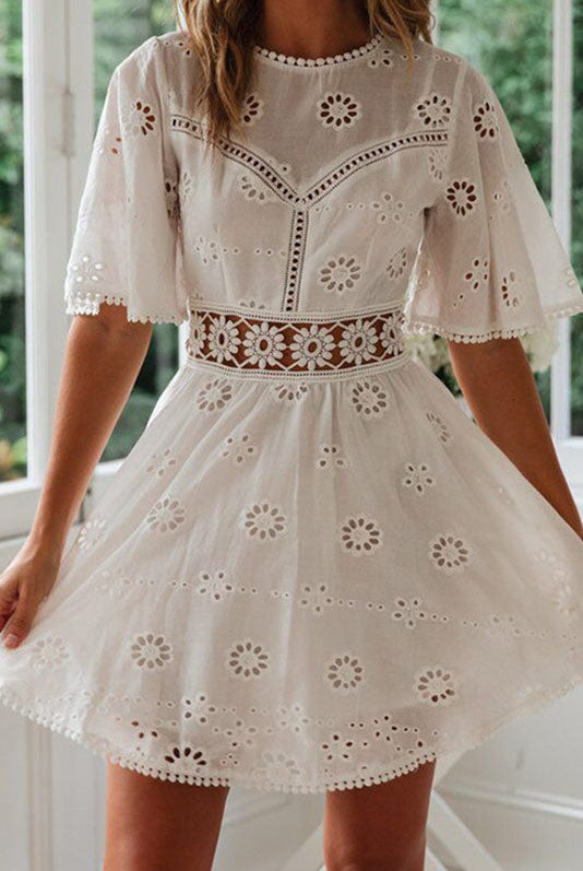 Arabella Celestine white eyelet mini dress by Lumina Vancouver, featuring a feminine, lightweight design and eyelet fabric details.