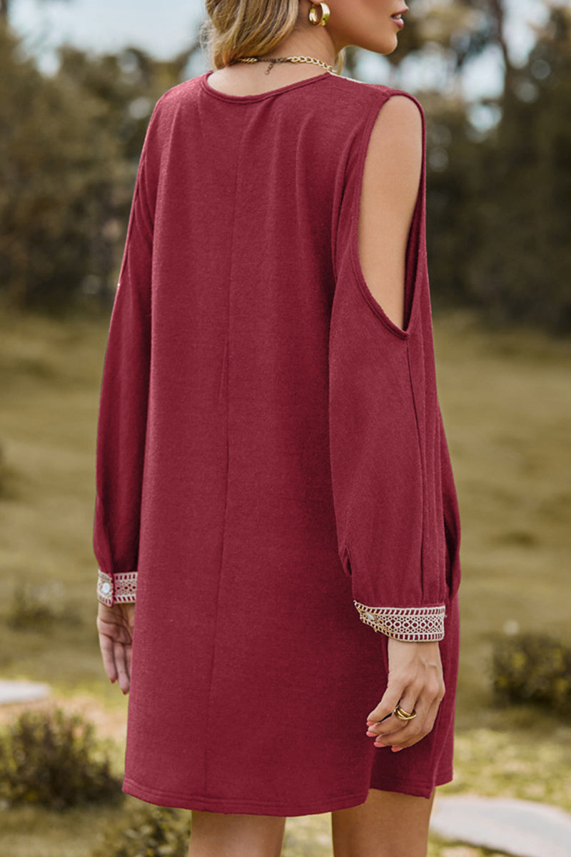 Black Aria Lumina Vancouver casual mini dress with V-neck and lace trim, shown on a model.
