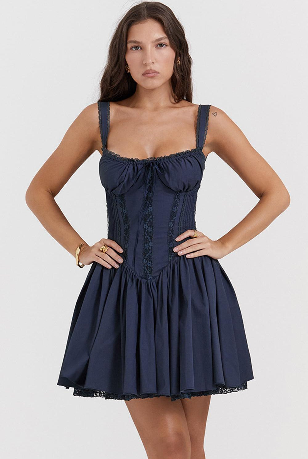 White mini dress by Lumina Wear featuring a lace-trimmed bodice and a fitted silhouette, perfect for stylish daytime wear.