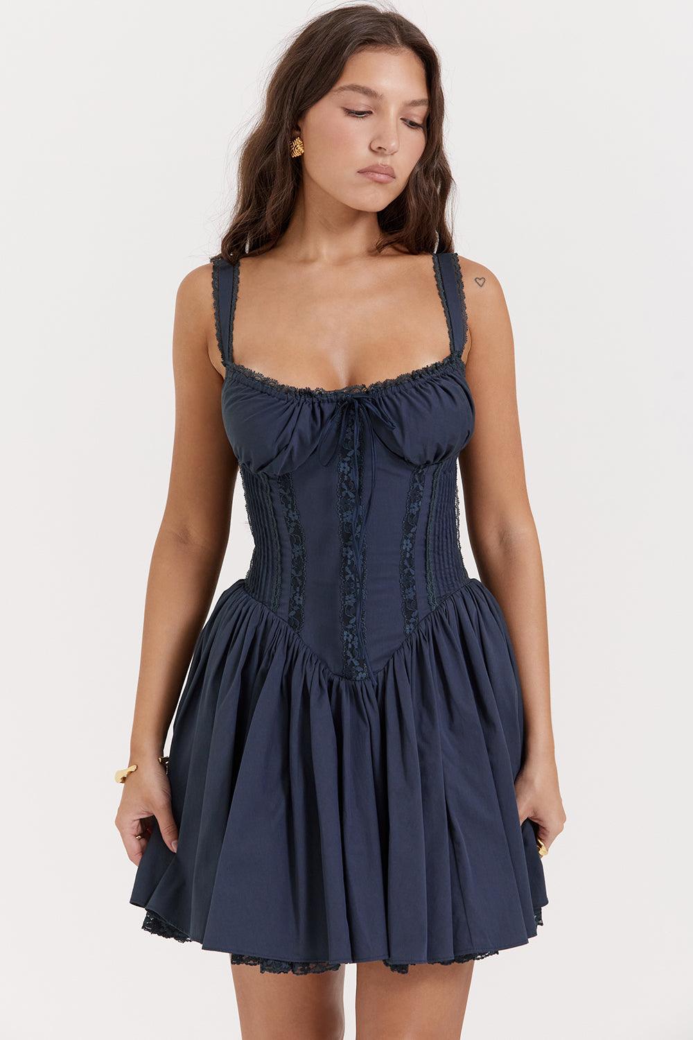 White mini dress with lace-trim bodice by Lumina Vancouver, featuring a fitted silhouette and delicate lace details.