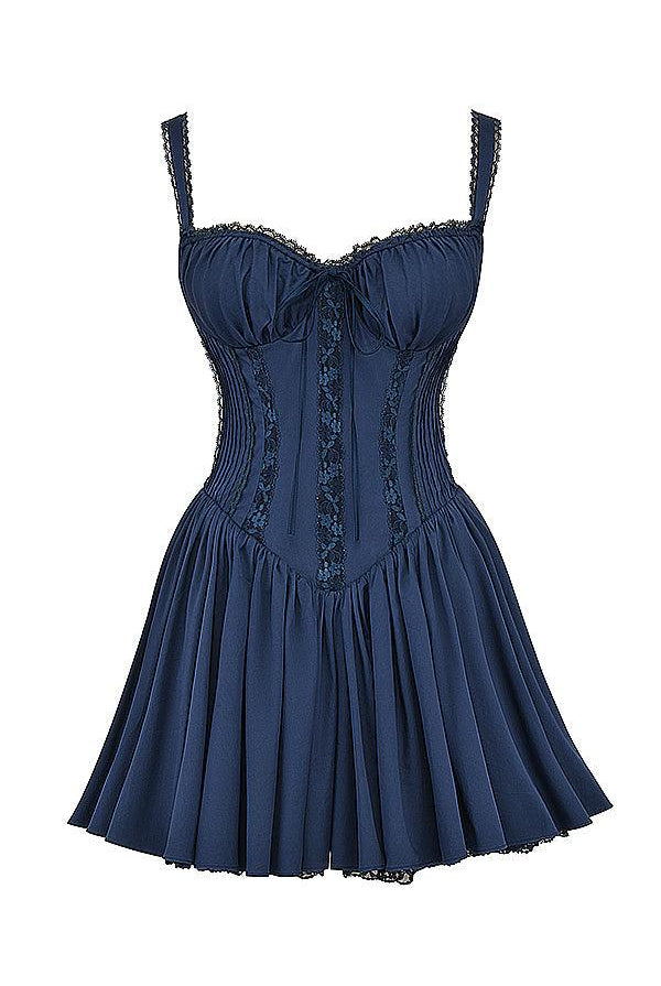 White mini dress by Lumina Wear featuring a lace-trimmed bodice and a fitted silhouette.