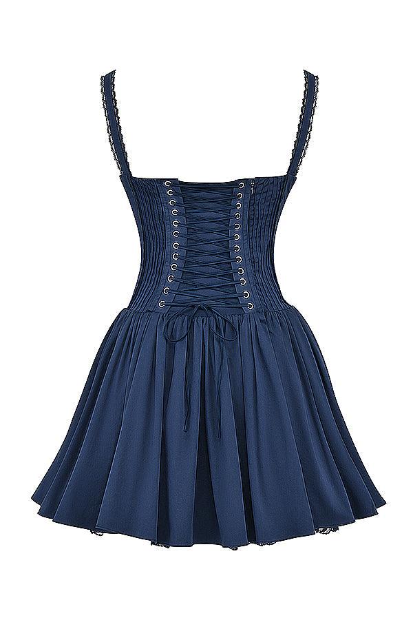 White mini dress with lace-trim bodice by Lumina Vancouver, featuring a fitted silhouette and delicate lace details.