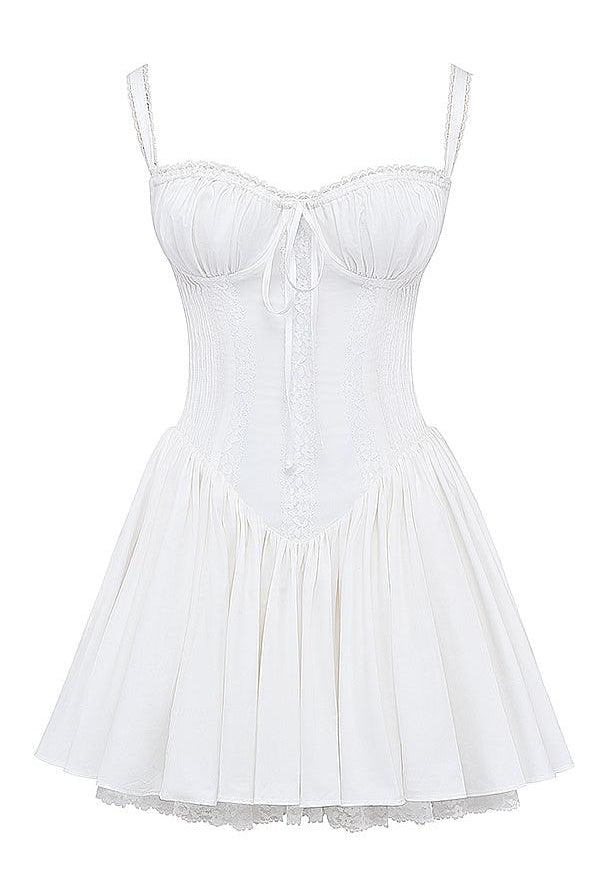 White mini dress by Lumina Wear featuring a lace-trimmed bodice and a fitted silhouette.