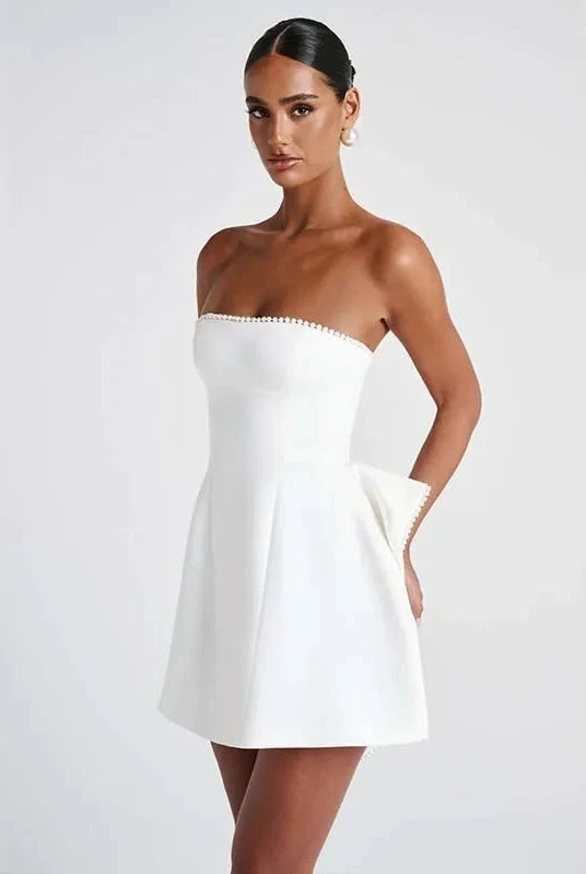 White strapless satin mini dress from Lumina Wear's Anneli collection, featuring a sleek, fitted design perfect for elegant occasions.