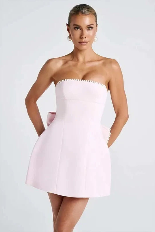 White strapless satin mini dress by Lumina Wear, featuring a fitted silhouette and elegant design for special occasions.