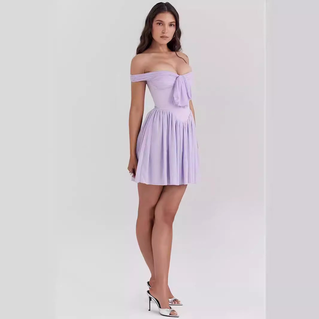 Lavender purple Aria off-shoulder mini dress by Lumina Vancouver with a bow front detail, perfect for stylish summer occasions.
