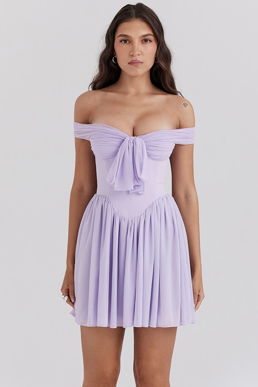 Lavender purple Aria off-shoulder mini dress by Lumina Vancouver with a bow front, stylish and perfect for summer occasions.