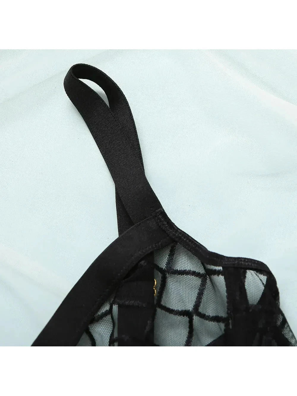 Lumina Vancouver Tellervo Bodysuit in sleek black, featuring a fitted design and scoop neckline, perfect for stylish wear.