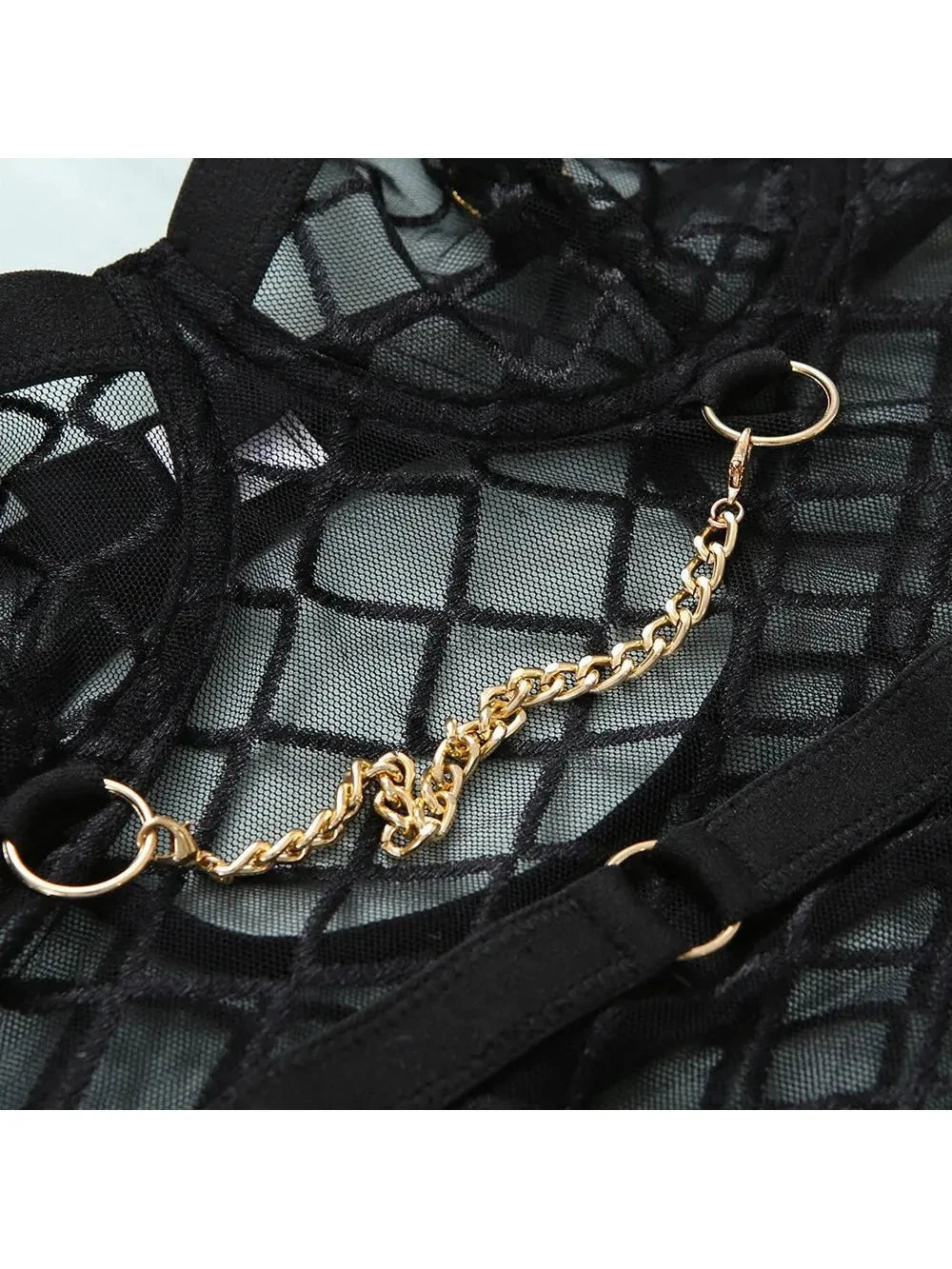 Lumina Vancouver Tellervo Bodysuit in sleek black fabric, close-up view of fitted design and seamless construction.