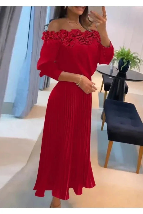 Red off-shoulder maxi dress by Lumina Wear featuring flowing fabric and elegant design, perfect for formal occasions.