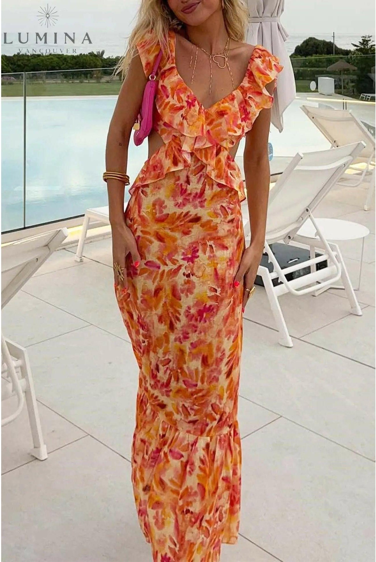 Orange Ariella floral ruffle dress by Lumina Wear for girls, featuring a playful floral pattern and ruffled details.